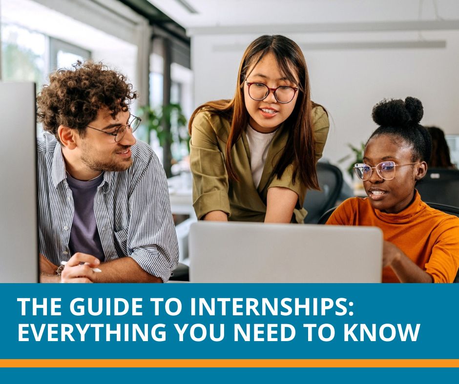 Interns around a computer