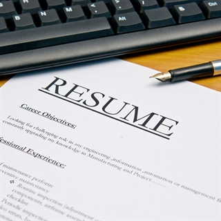 Resume with career details, pen, keyboard, and blog headline text with ECE logo.
