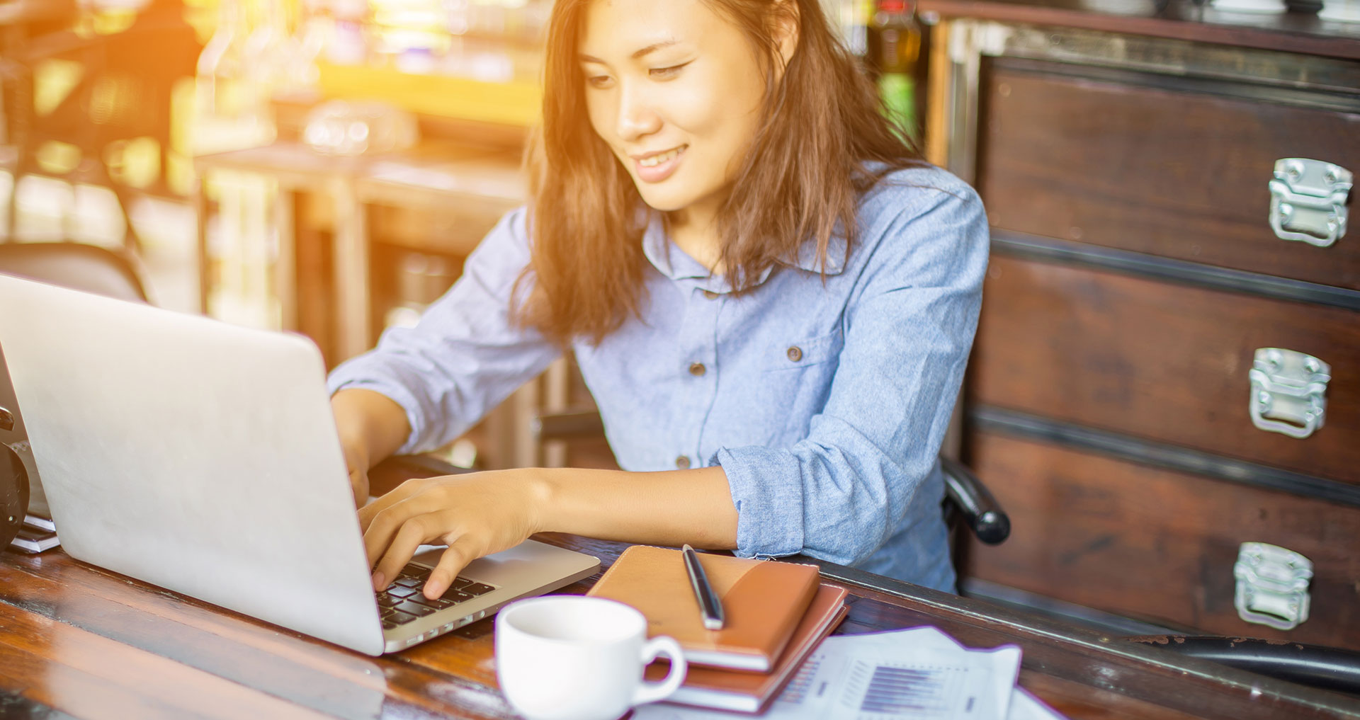 Woman reading the annual report on her laptop